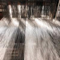 Titel: Kettfäden im Webstuhl